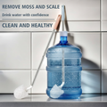 Long cleaning brush being inserted into 19L water gallon bottle removing moss and scale